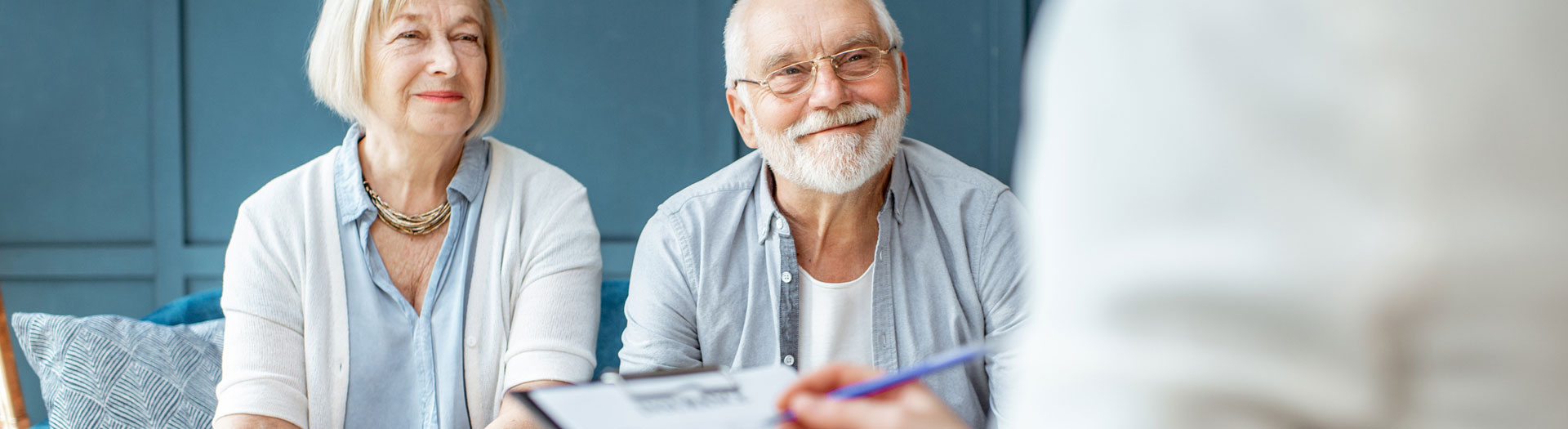 Older couple consulting with a retirement planner